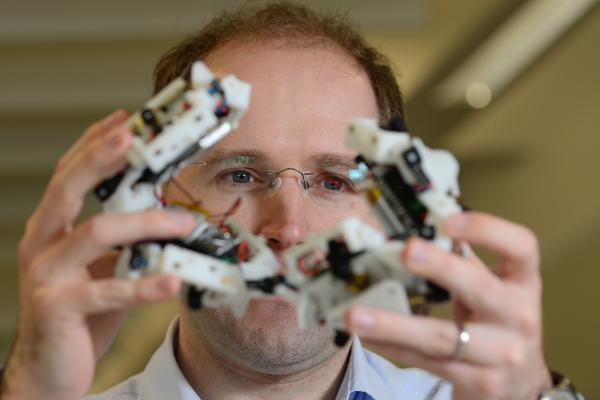 man with artificial intelligence robot