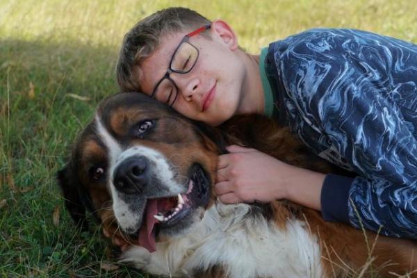 A 15-year-old boy with his dog