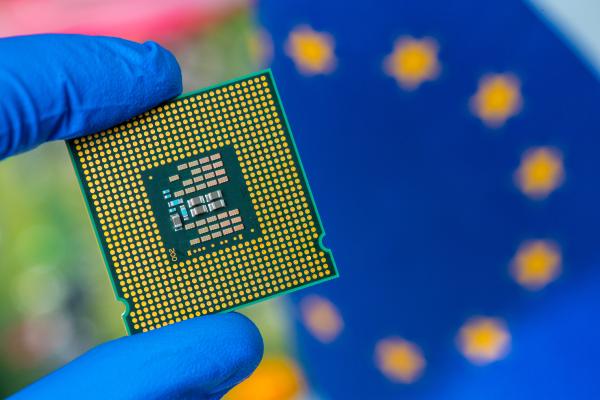 A microchip in front of the European flag