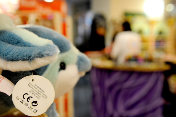 Blue and white cuddly toy with EU safety CE tag round its neck