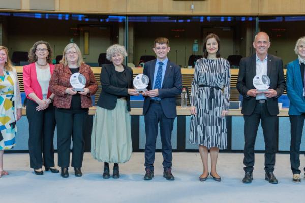 Winners of the EU gender equality champions awards standing in a line