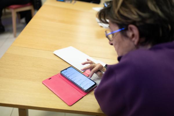An elderly woman using a mobile phone
