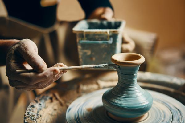  painting handmade pottery at ceramic workshop
